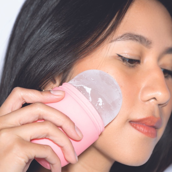 ice roller, face massager, skincare tool, facial ice mold, cold therapy roller, product demo, lifestyle, calm, fresh, pink, neutral