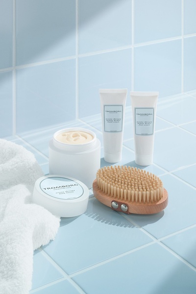 body lotion, hand cream, foot cream, skincare products, body brush, product demo, minimalist, calm, fresh, blue, neutral