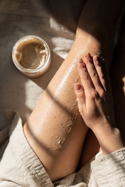 body scrub, exfoliating scrub, skin exfoliant, body polish, skincare product, product demo, lifestyle, minimalist, calm, fresh, neutral