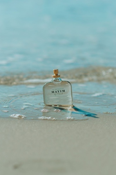 perfume bottle, eau de toilette, fragrance bottle, cologne bottle, scent bottle, brand awareness, lifestyle, outdoor, fresh, calm, blue, neutral