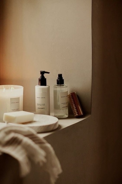 skincare bottles, scented candle, bath soap, beauty products, grooming accessories, brand awareness, minimalist, lifestyle, calm, luxurious, neutral, brown