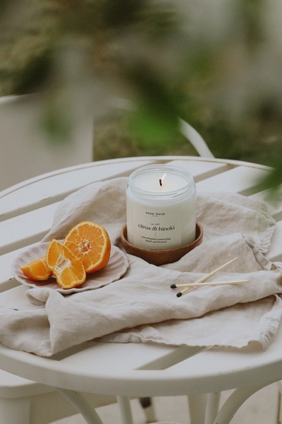 scented candle, jar candle, luxury candle, home fragrance, poured candle, product demo, lifestyle, minimalist, calm, fresh, neutral, orange